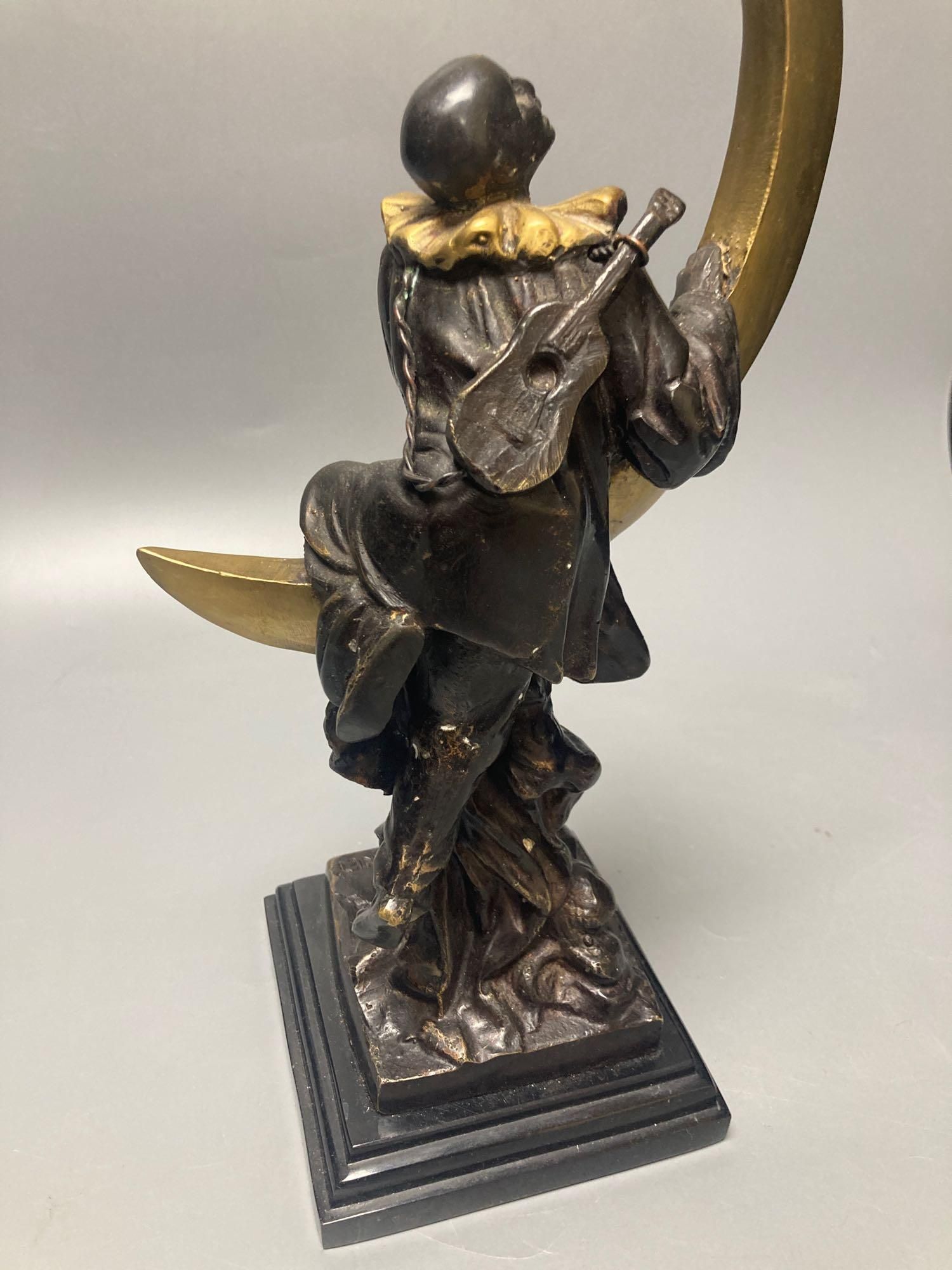 After A. Colinet bronze of Pierrot on a quatre moon, 33cm. high